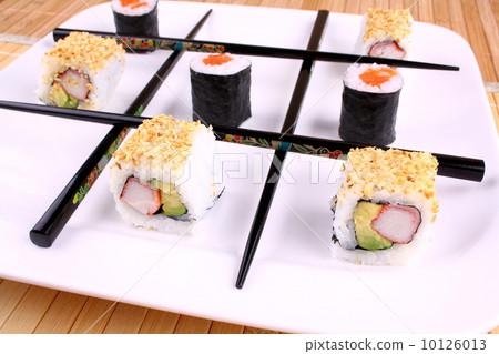 Tic tac toe play with chopsticks and sushi 10126013
