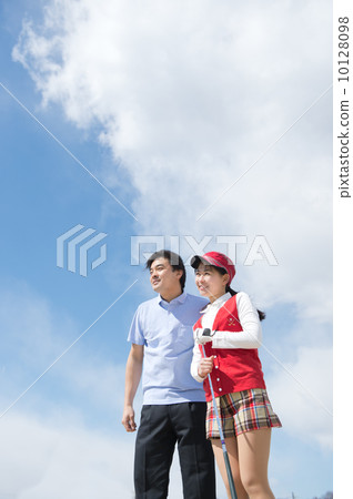A couple playing golf 10128098