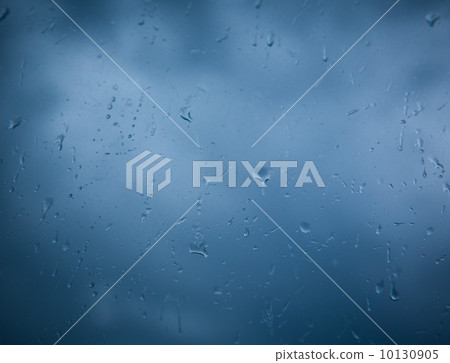 Rain drops on window across clouds Rain drops on window across clouds 10130905