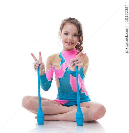 Cheerful little gymnast posing with mace Cheerful little gymnast posing with mace 10132324
