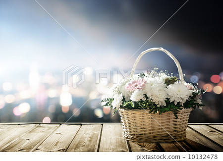 flowers in basket and lights of night city 10132478