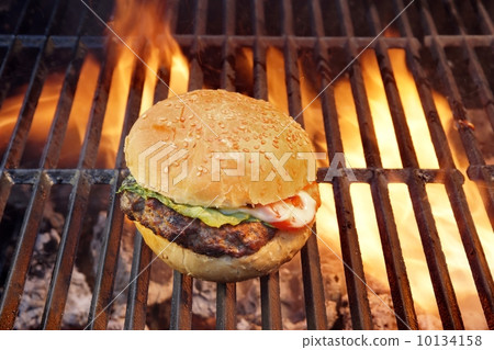 grilled cheeseburger and burning flame grilled cheeseburger and burning flame 10134158