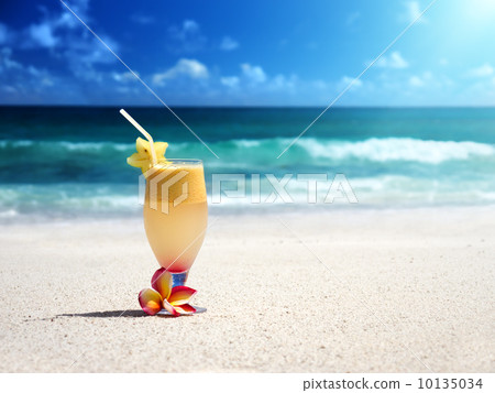 fresh fruit mix of juices on a tropical beach fresh fruit mix of juices on a tropical beach 10135034