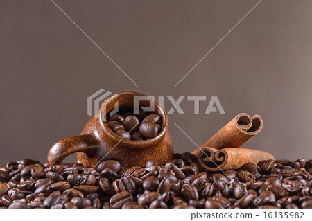 Background of coffee beans with cup Background of coffee beans with cup 10135982