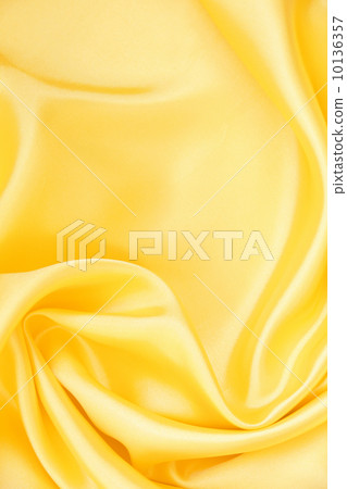 Smooth elegant golden silk as background Smooth elegant golden silk as background 10136357