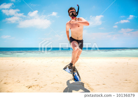 Funny man jumping in flippers and mask. Funny man jumping in flippers and mask. 10136879