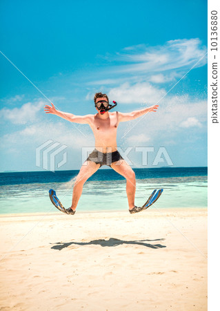 Funny man jumping in flippers and mask. Funny man jumping in flippers and mask. 10136880