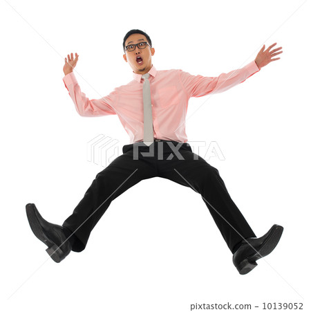 Asian businessman falling backwards Asian businessman falling backwards 10139052