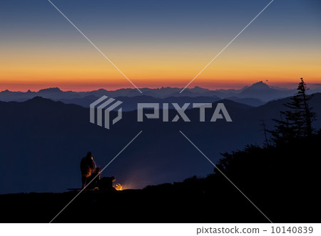 NIght time camping on a mountain top with a beautiful sunset view 10140839