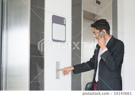 Indian businessman entering elevator 10143661