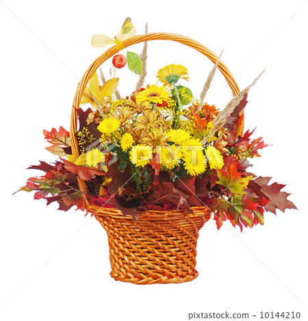 Flowers arrangement centerpiece in wicker basket. Flowers arrangement centerpiece in wicker basket. 10144210