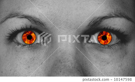 Detail view of female eyes with flames 10147598