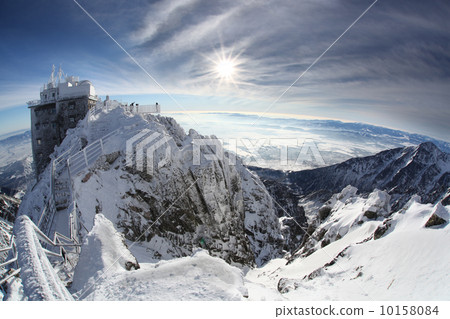 Amazing view of High winter Mountains against blue sky 10158084