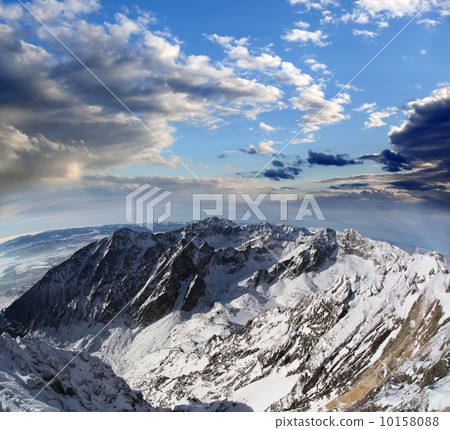 Amazing view of High winter Mountains against blue sky 10158088