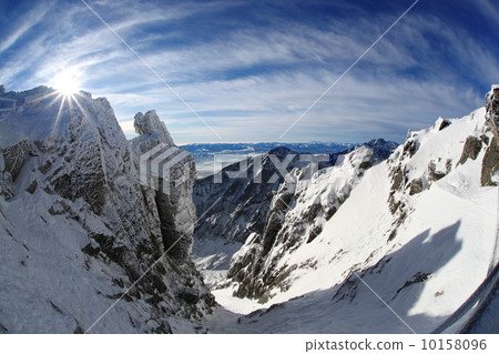 Amazing view of High winter Mountains against blue sky 10158096