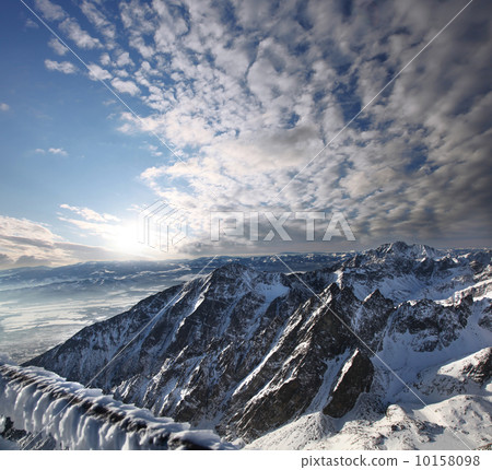 Amazing view of High winter Mountains against blue sky 10158098