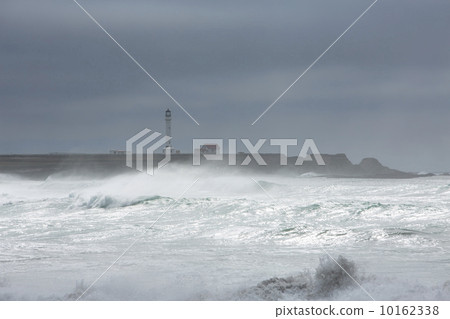 Stormy ocean historic California Lighthouse on coast 10162338