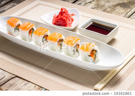 Seafood Sushi rolls in White Long Dish with soy sauce 10162861