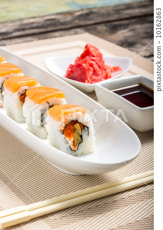 Seafood Sushi rolls in White Long Dish with soy sauce 10162863