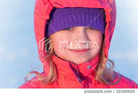 little ruddy nice girl in winter outwear with hood smiles little ruddy nice girl in winter outwear with hood smiles 10166608