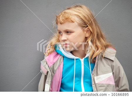 Little blond girl wears casual sport clothes. Outdoor photo Little blond girl wears casual sport clothes. Outdoor photo 10166895