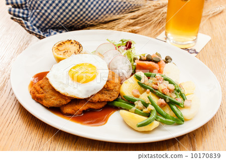 Wiener Schnitzel with Potatoes and Fresh Vegetables 10170839