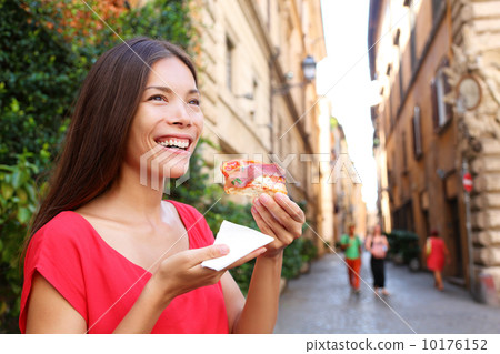 Pizza woman eating pizza slice in Rome, Italy 10176152