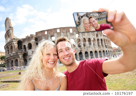 Tourist couple on travel in Rome by Coliseum 10176197