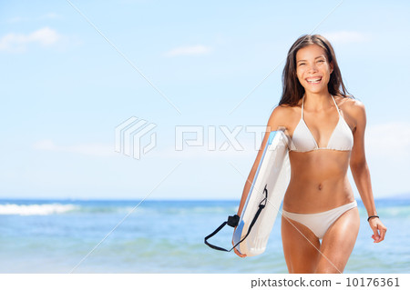 Woman surfer girl on beach 10176361