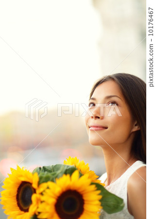Flower woman holding sunflower smiling happy 10176467