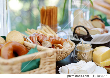 Fresh cheese and bread on a table 10183656