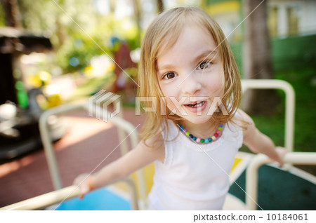 Cute little girl funny portrait outdoors Cute little girl funny portrait outdoors 10184061