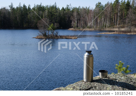 Thermos by forest lake side 10185241