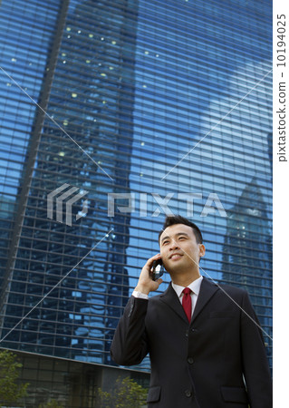 Asian businessman with mobile phone 10194025