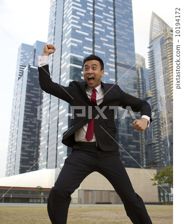 Asian businessman jumping and celebrating success Asian businessman jumping and celebrating success 10194172