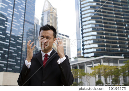 Asian businessman in despair Asian businessman in despair 10194275