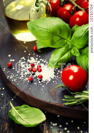 Tomatoes with basil on wooden table background 10195704