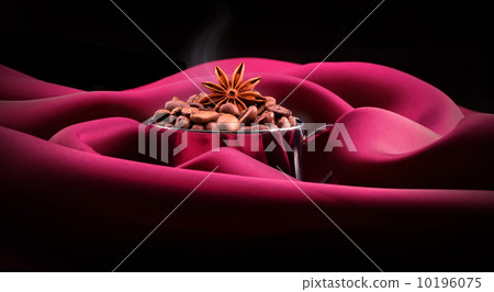 cup of Coffee with beans on red silk cup of Coffee with beans on red silk 10196075