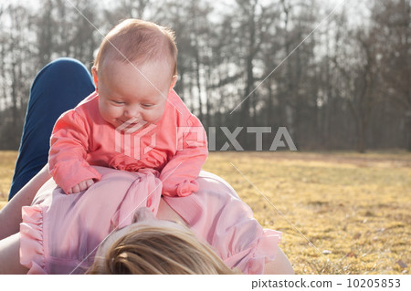 Baby is having fun on moms belly Baby is having fun on moms belly 10205853