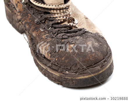 Part of old dirty hiking boot on white background 10219888