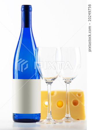 Blue bottle of white wine, two wine glasses and cheese Blue bottle of white wine, two wine glasses and cheese 10249756