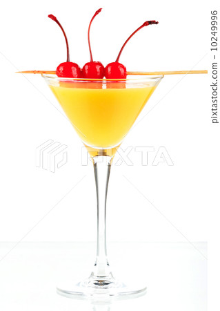 Alcohol cocktail with orange juice and three maraschino 10249996