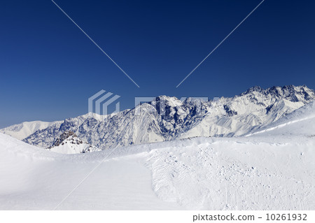 Trace of avalanche on snow slope 10261932