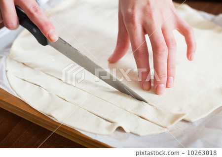 hands cutting store-bought dough hands cutting store-bought dough 10263018