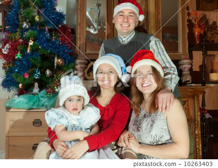 Happy family posing for Christmas portrait 10263403