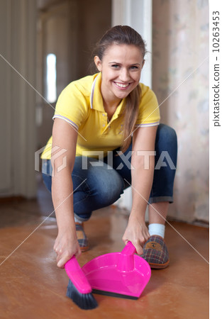 Woman sweeping the floor 10263453