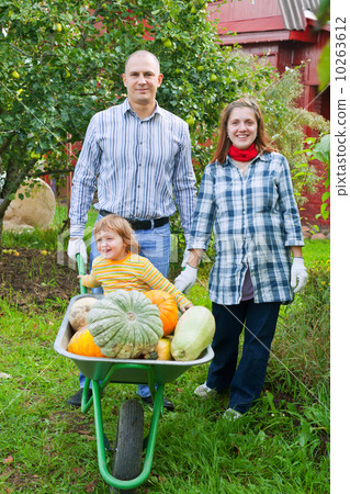 Happy family in garden Happy family in garden 10263612