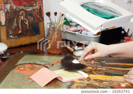 restoration of old icon with gold leaf 10263741