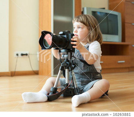 girl takes photo with camera 10263881