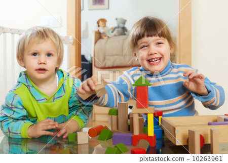 Emotional  children playing with wooden toys 10263961